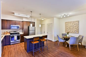 Furnished kitchen with espresso cabinets